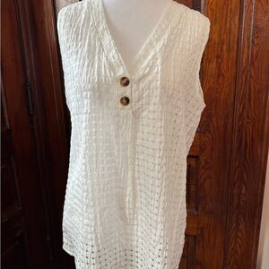 Elegant Sleeveless Cream Blouse with Button Accents